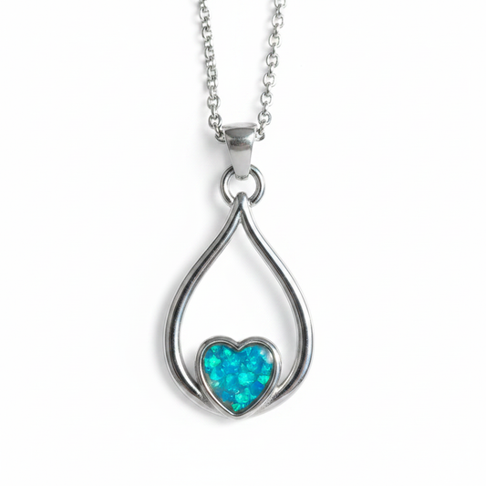 316L stainless steel eternal heart loop memorial pendant necklace with blue teal opal resin in heart bezel on white background