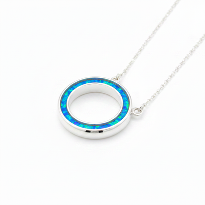 Silver 925 Circle of Life memorial pendant with blue opal resin on chain, white background