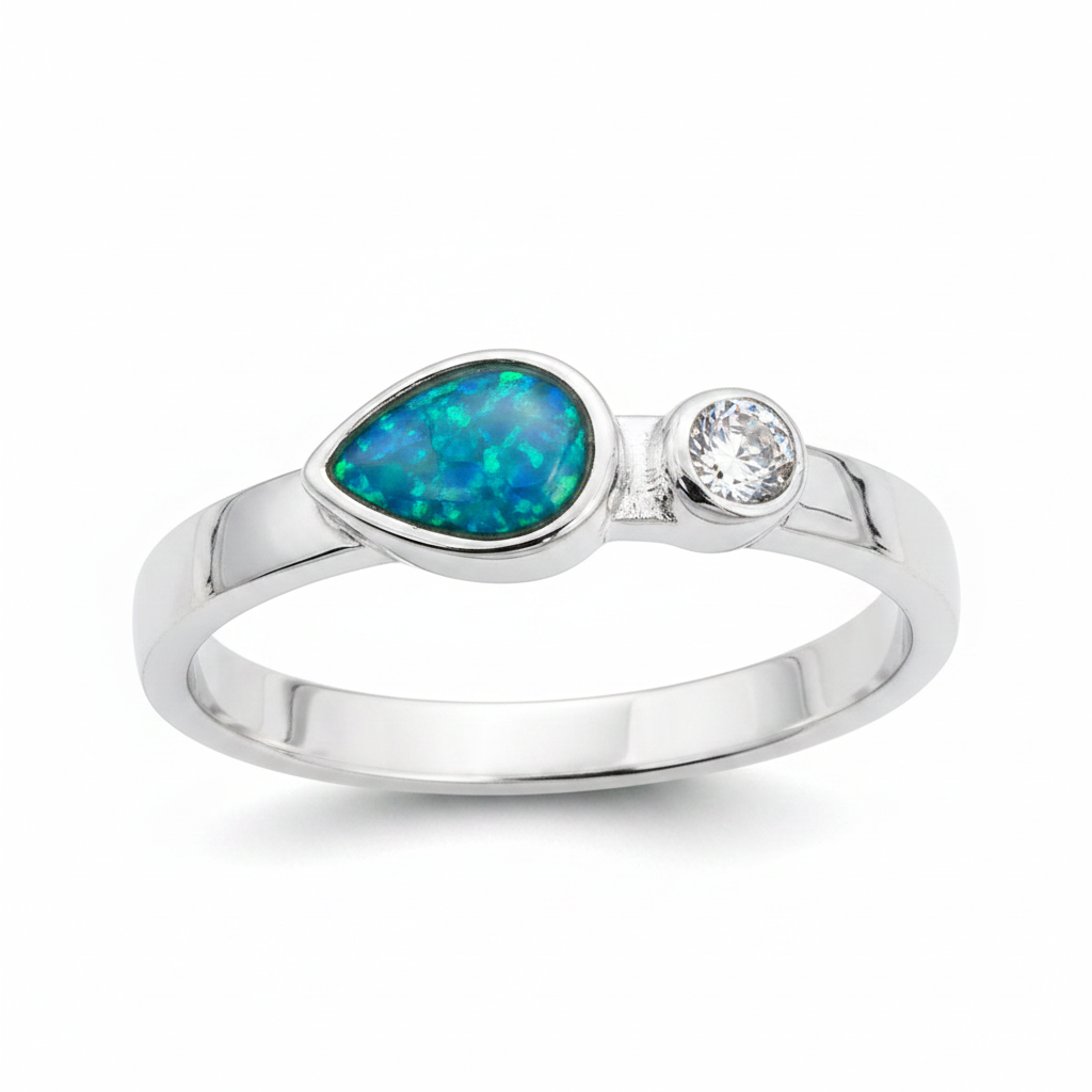 Teardrop single gem 925 silver ring with blue teal opal resin in pear setting on white background