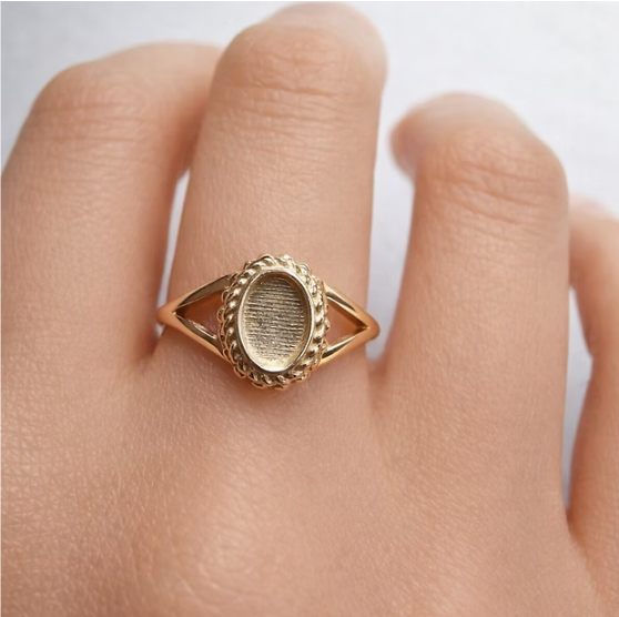 9ct rose gold oval rope split shank ring worn on finger showing true scale and split shank detail