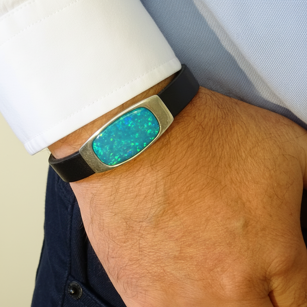Silver 925 gents leather memorial bracelet worn on man's wrist — editorial lifestyle shot, white shirt