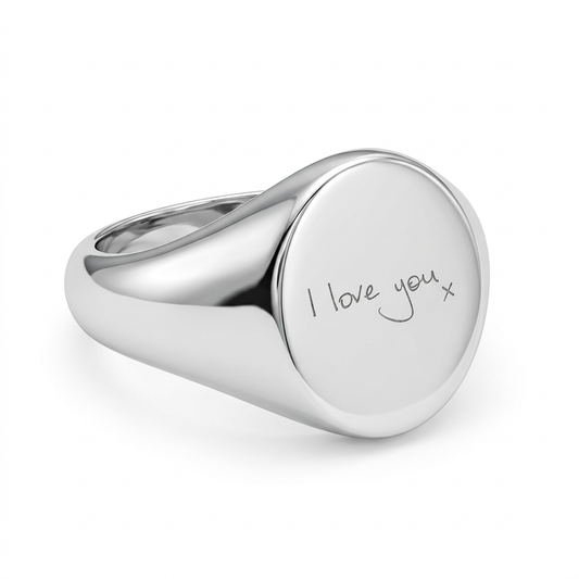 Illustrative polished small oval silver signet ring with I love you x handwriting engraving
