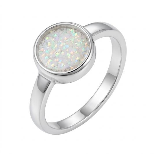 Illustrative thick-trim round silver memorial ring with pearl white opal flakes