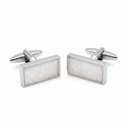 Heavy stainless steel rectangle memorial cufflinks with white pearl opal shimmer resin inclusion on white background