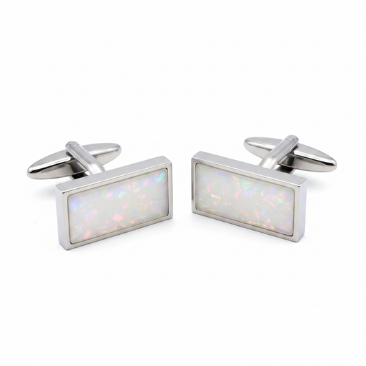 Heavy stainless steel rectangle memorial cufflinks with white pearl opal shimmer resin inclusion on white background