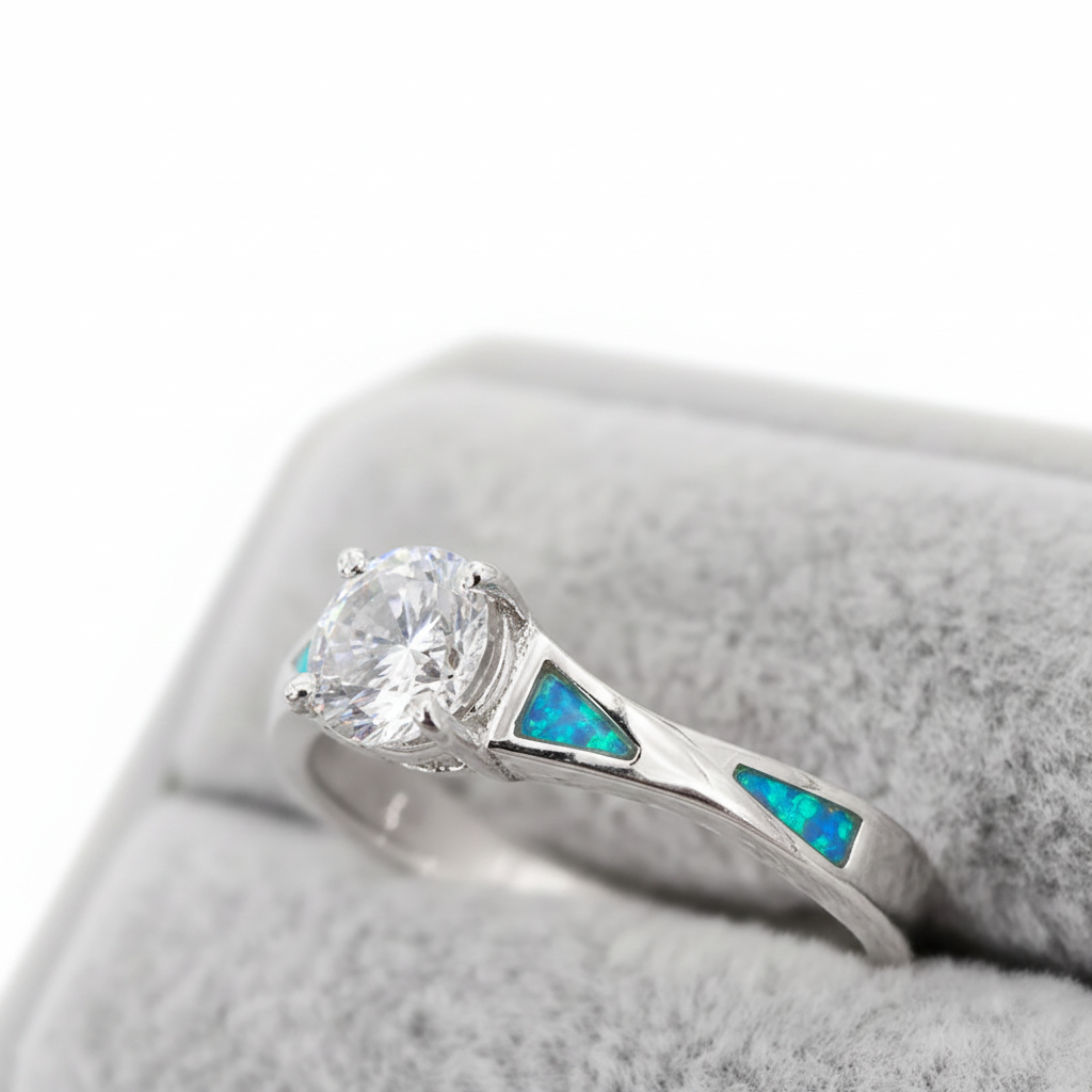 Twisted channel solitaire 925 silver ring with blue teal opal resin side angle view white background