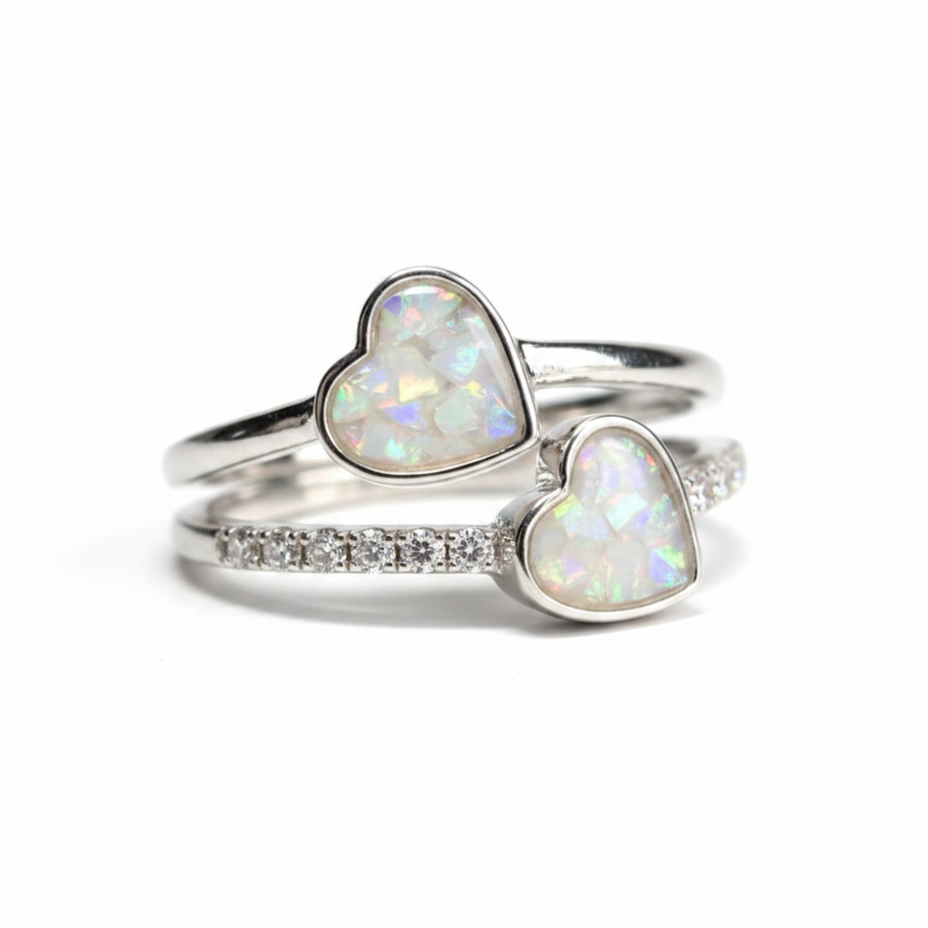 925 sterling silver double heart CZ memorial ring with white pearl opal flakes in twin heart bezels on white background