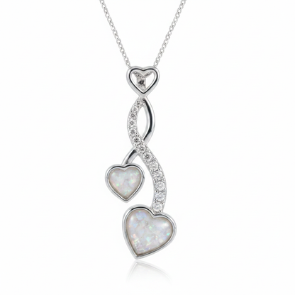 Silver 925 cascading twin heart CZ memorial pendant with white opal and mica resin on chain, white background