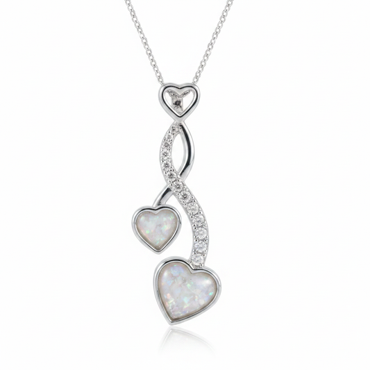 Silver 925 cascading twin heart CZ memorial pendant with white opal and mica resin on chain, white background