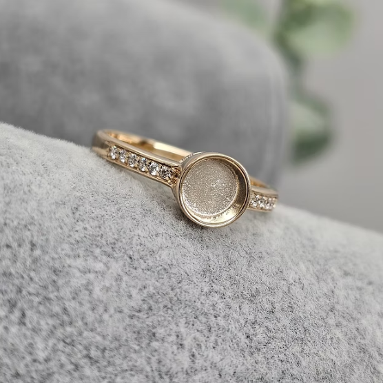 9ct yellow gold 6mm round bezel CZ ring angled view showing centre setting and CZ pavé band