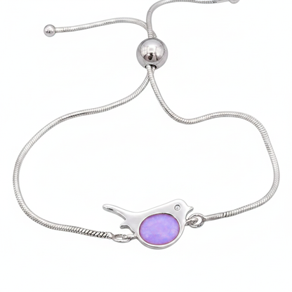 Robin silver snake chain bracelet with lavender purple opal resin in robin bezel, white background