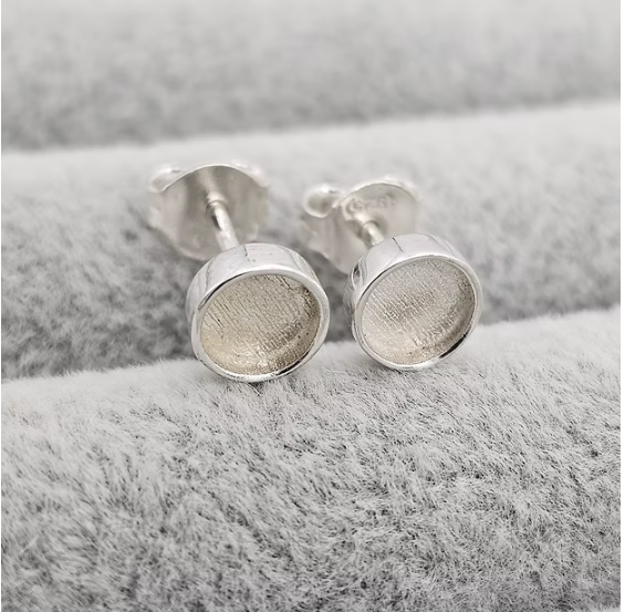 Silver 925 round bezel stud earrings close up on grey velvet — blank silver