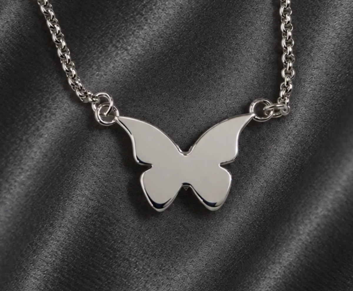 Smooth back of the butterfly memorial necklace, ideal for engraving