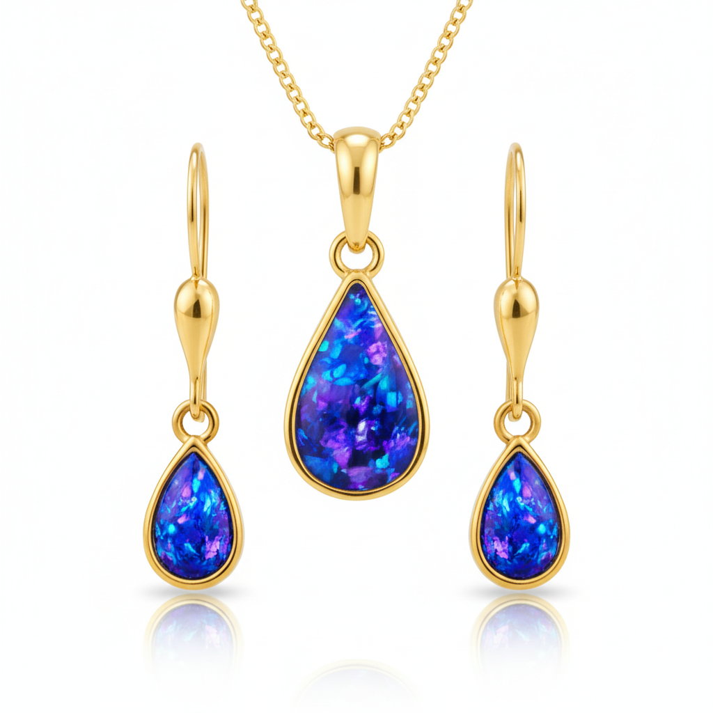 Close-up detail of matching blue opal flakes across 9ct gold teardrop memorial pendant and earrings set