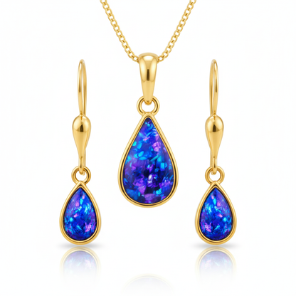 Close-up detail of matching blue opal flakes across 9ct gold teardrop memorial pendant and earrings set
