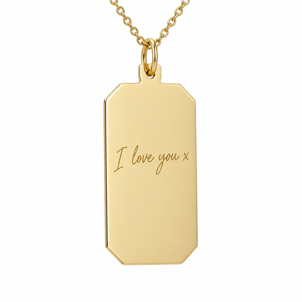 Illustrative handwriting engraving on plain 9ct yellow gold rectangular pendant on matching gold chain against white
