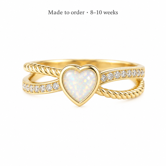 Illustrative 9ct gold Heart Twist Split Shank CZ ring with pearl white opal resin in the heart bezel