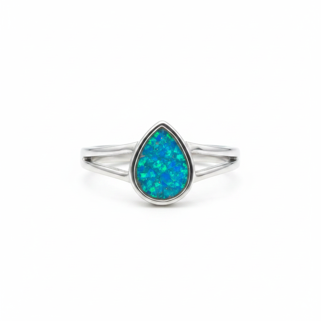 925 sterling silver split shank teardrop memorial ring with blue teal opal resin in teardrop bezel on white background