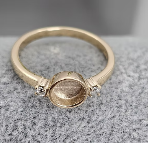 9K yellow gold round double gem CZ ring angled view on grey fabric