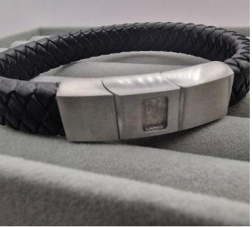Black braided leather memorial bracelet with brushed stainless steel sliding magnetic clasp showing rectangle resin recess