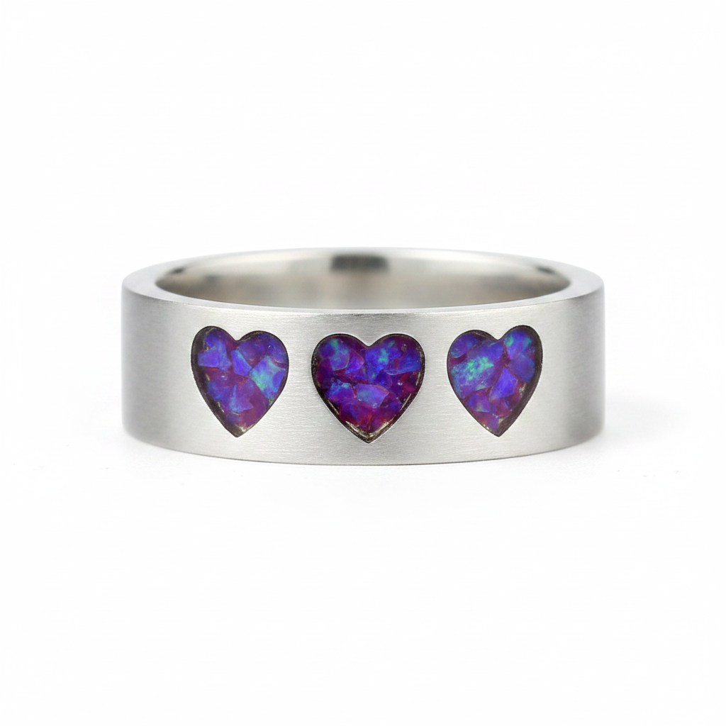 925 sterling silver three hearts memorial band ring with lavender purple opal flakes in recessed heart settings on white background