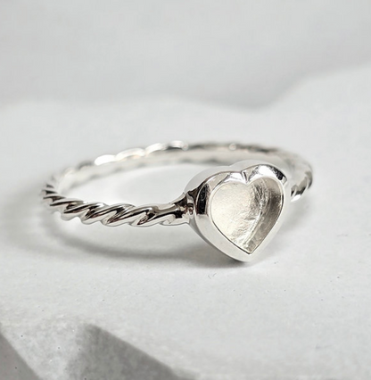 925 sterling silver twist heart memorial ring — side angle showing heart bezel and twisted band profile