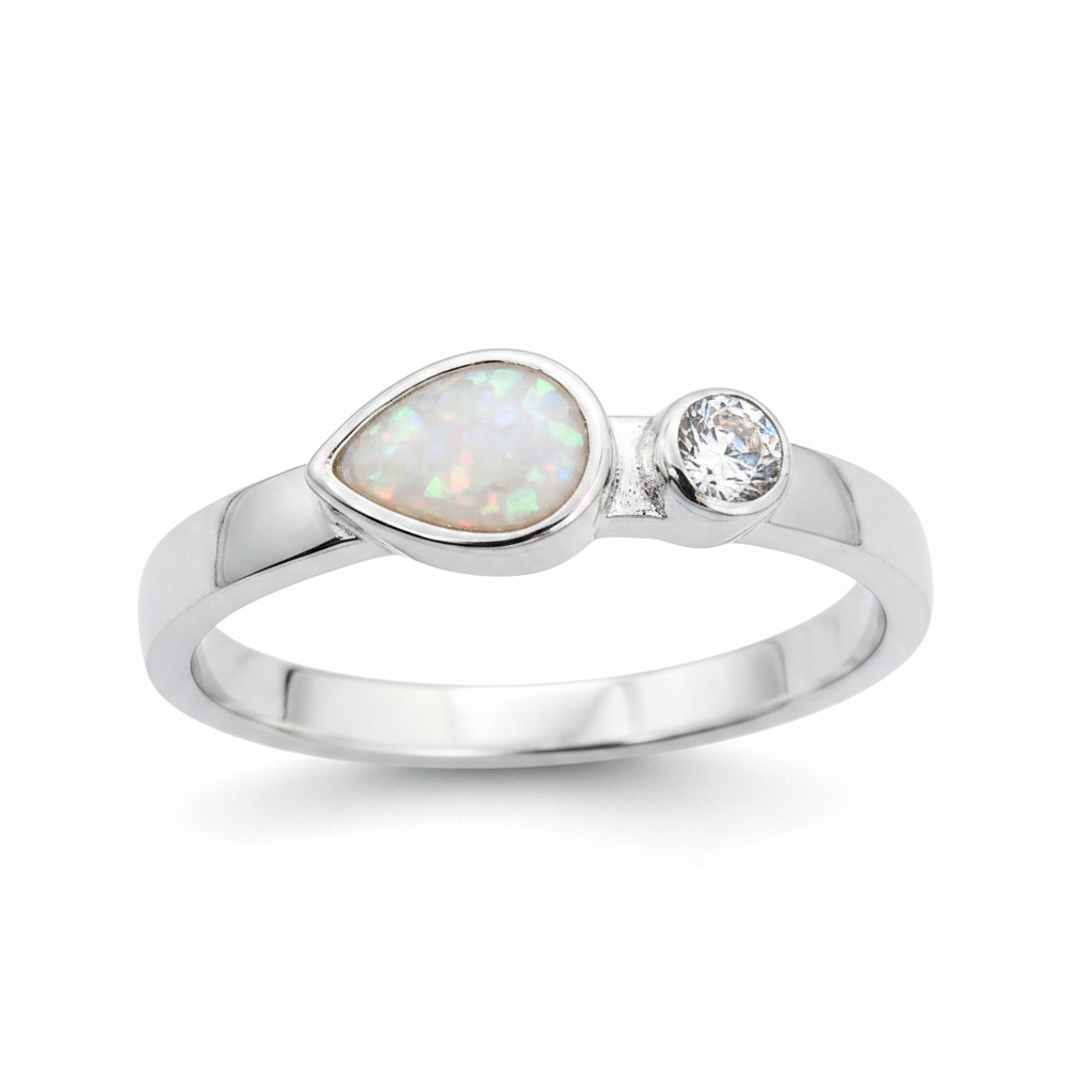 Teardrop single gem 925 silver ring with white pearl opal resin in pear setting on white background