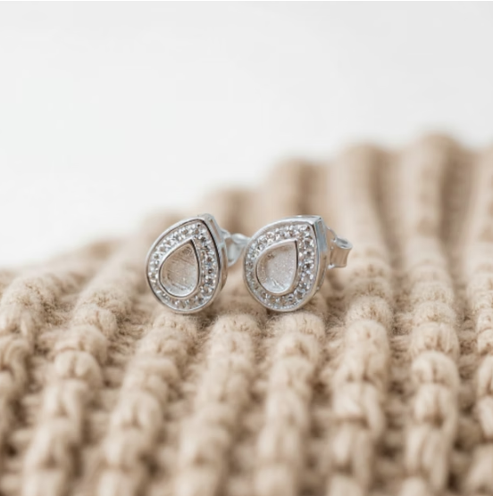Silver 925 pear CZ halo stud earrings on knit fabric — blank silver