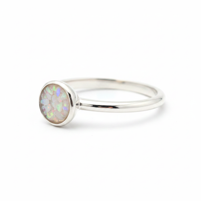 925 sterling silver 5mm round cabochon memorial ring with white pearl opal and mica shimmer in flat round resin setting on white background