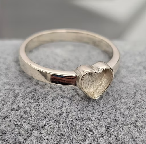 9ct white gold plain heart ring blank, angled view showing raised heart bezel sitting proud of the delicate polished band
