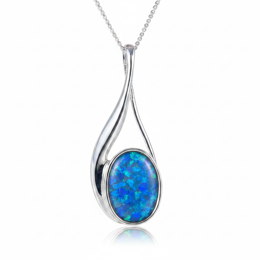 Elegant silver 925 teardrop twist memorial pendant with blue opal flakes, white background