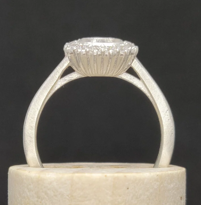 925 sterling silver cushion cut halo memorial ring — front view on wooden cone showing full cushion CZ halo and cathedral shank profile