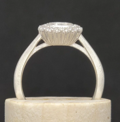 925 sterling silver cushion cut halo memorial ring — front view on wooden cone showing full cushion CZ halo and cathedral shank profile