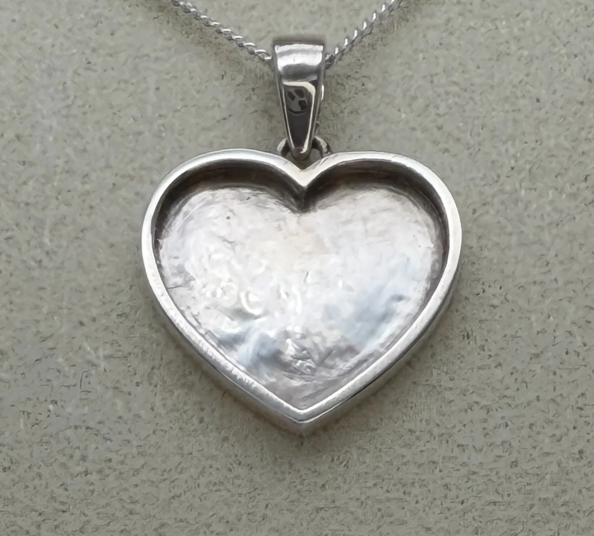925 sterling silver plain heart pendant close-up showing deep bezel recess 12mm x 15.3mm and polished edge ready for resin