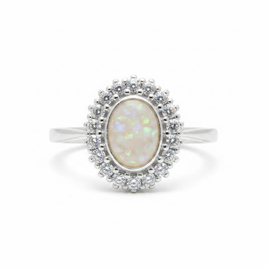 925 sterling silver oval CZ halo memorial ring with white pearl opal and mica shimmer in flat oval resin setting on white background