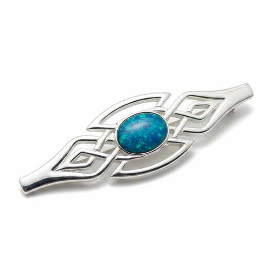 Silver 925 Celtic bar brooch with blue teal opal resin in 8x6mm central setting on white background