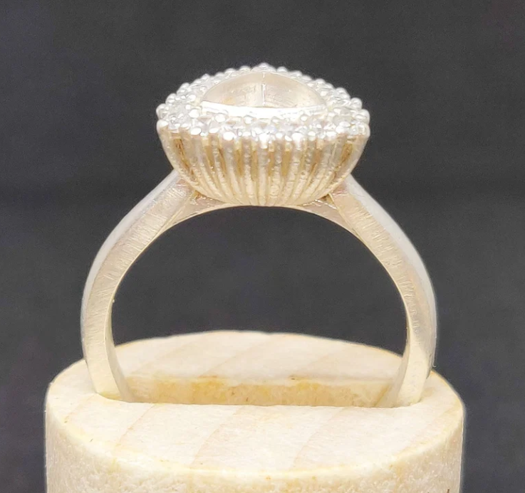 925 sterling silver trillion cut CZ halo memorial ring — side profile on wooden cone showing cathedral shank height and ribbed gallery detail