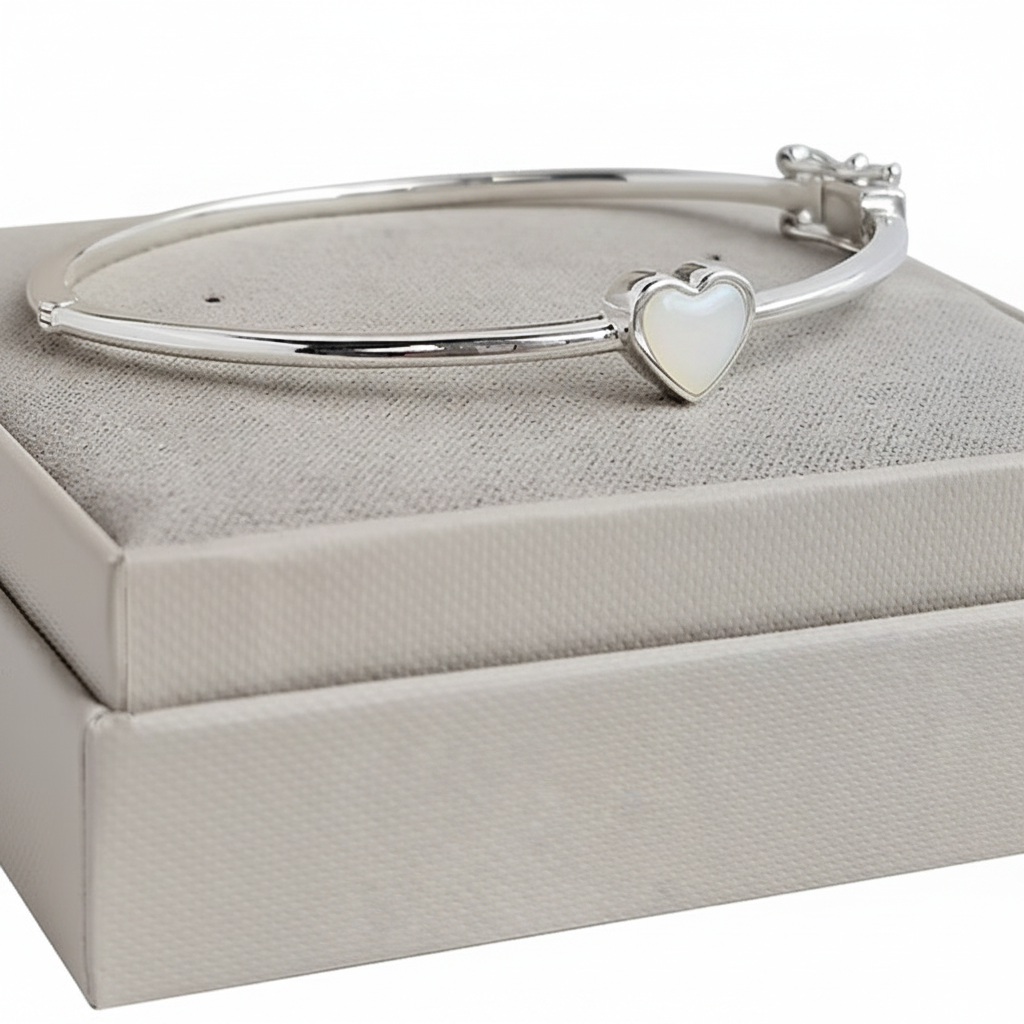 Bubble heart silver bangle with white pearl opal resin in heart bezel, white background