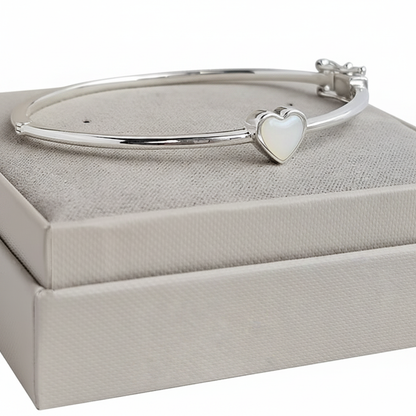 Bubble heart silver bangle with white pearl opal resin in heart bezel, white background