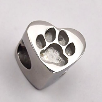 Stainless steel heart charm bead with paw print cutout design showing horizontal threading hole through centre for bracelet
