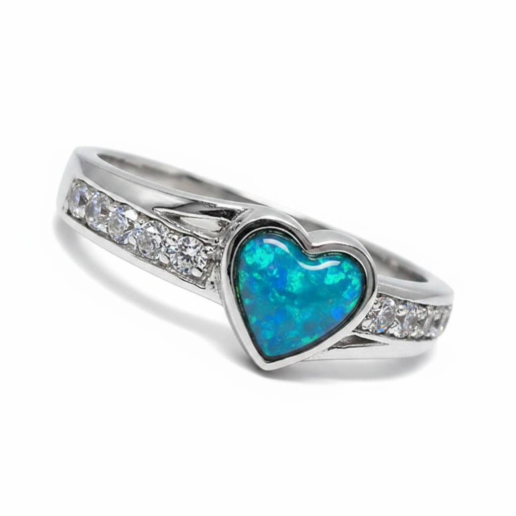 Heart accent CZ 925 silver ring with blue teal opal resin in 7x5mm heart setting on white background