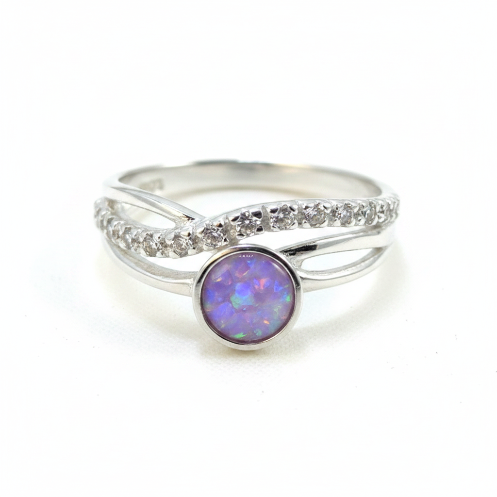 Silver 925 CZ crossover ring with lavender purple opal resin in 5mm central setting on white background