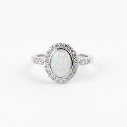 925 sterling silver oval CZ halo memorial ring with white pearl opal flakes in oval bezel on white background