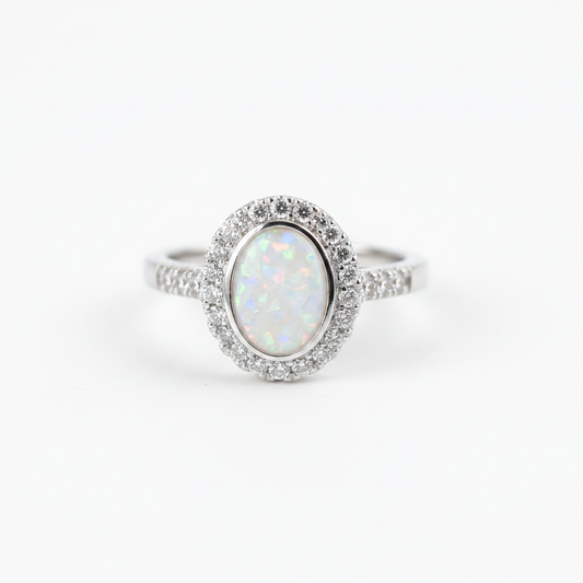 925 sterling silver oval CZ halo memorial ring with white pearl opal flakes in oval bezel on white background
