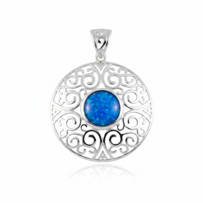 Heavy silver 925 filigree disc memorial pendant with blue opal flakes, white background