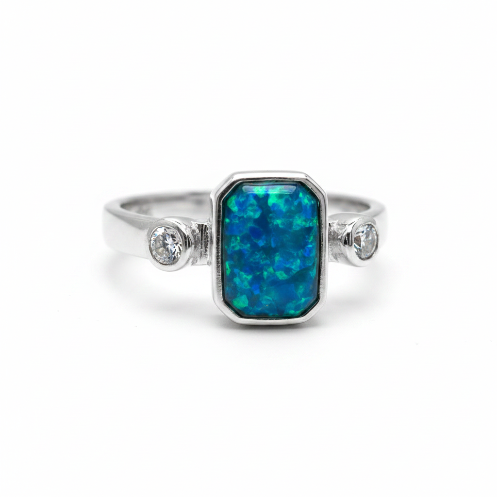 Double gem emerald 925 silver ring with blue teal opal resin top-down view on white background