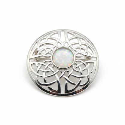 Silver 925 Celtic knot round brooch with white pearl opal resin in 8mm central setting on white background