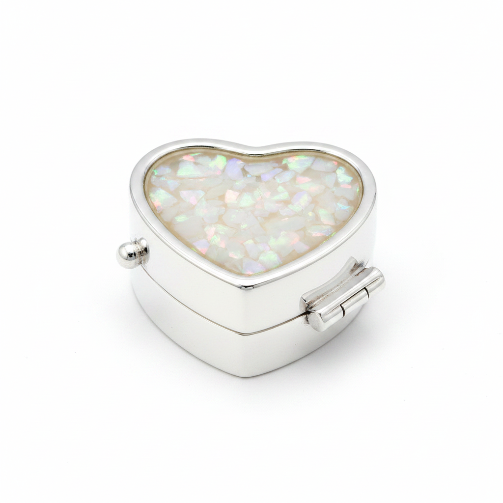 Silver 925 heart pill box with white pearl opal resin in open heart bezel top on white background