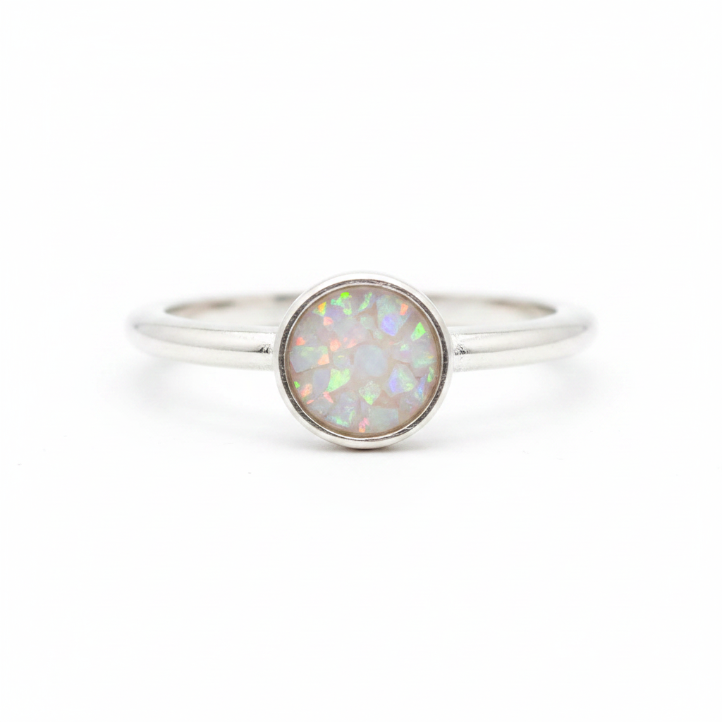 925 sterling silver 6mm cabochon rubover bezel memorial ring with white pearl opal and mica shimmer in flat resin setting on white background