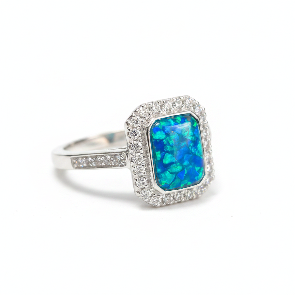 925 sterling silver rectangle CZ memorial ring with blue teal opal flakes in rectangular bezel on white background